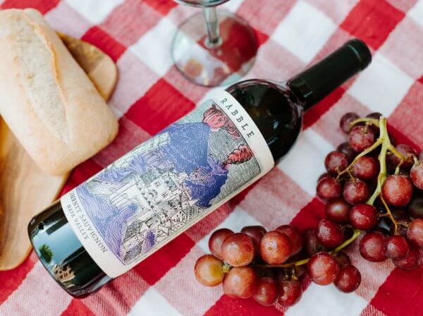 wine bottle on picnic blanket