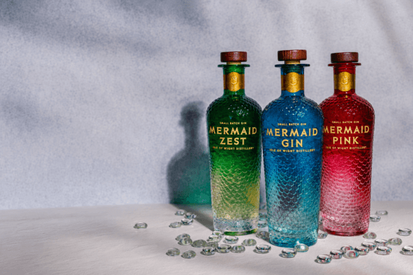 3 bottles of Mermaid Gin - green, blue and pink