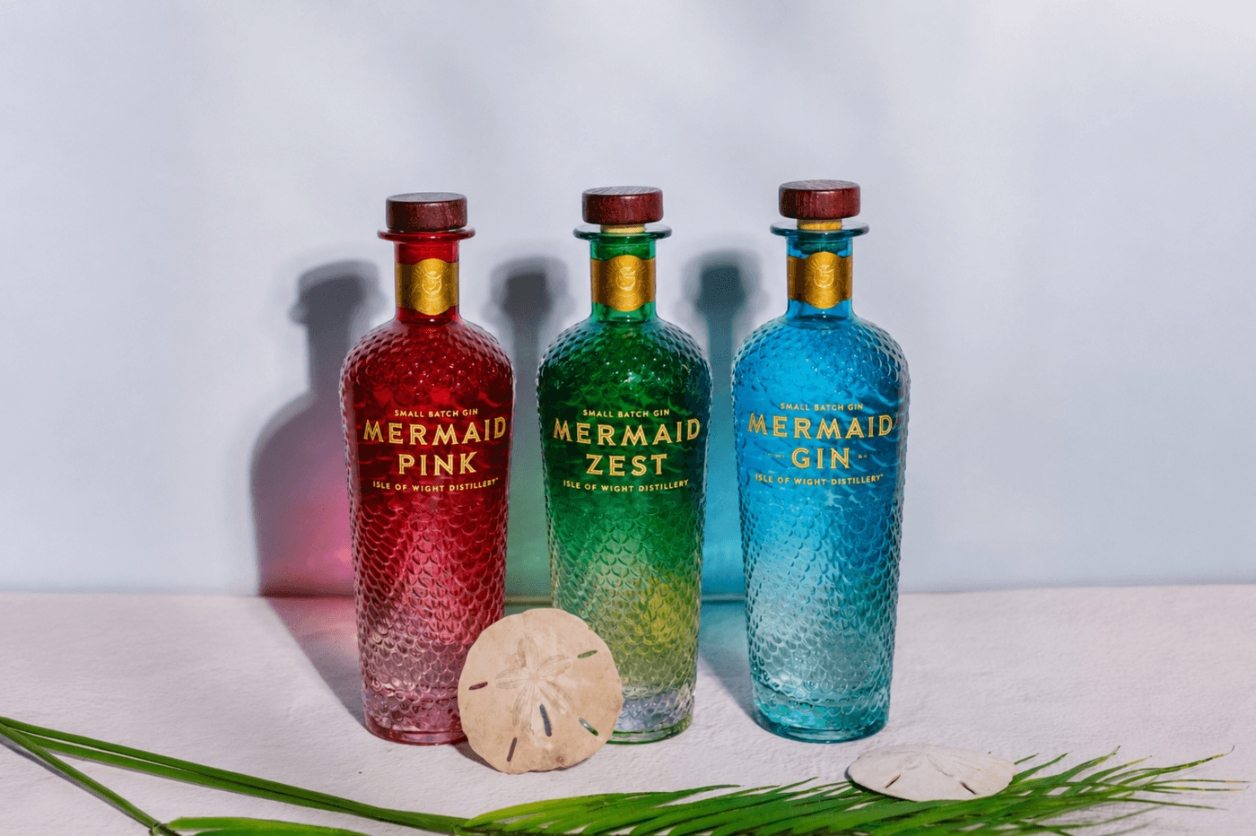 3 bottles of Mermaid Gin - pink, green and blue