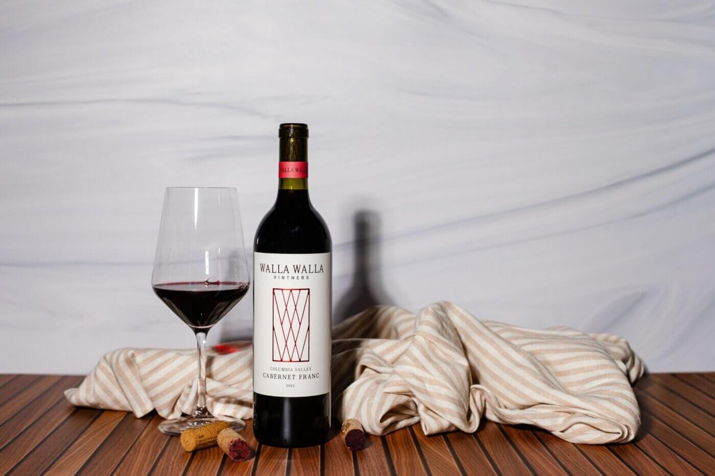 Columbia Valley Cabernet Franc 2022 wine bottle with wine glass filled up