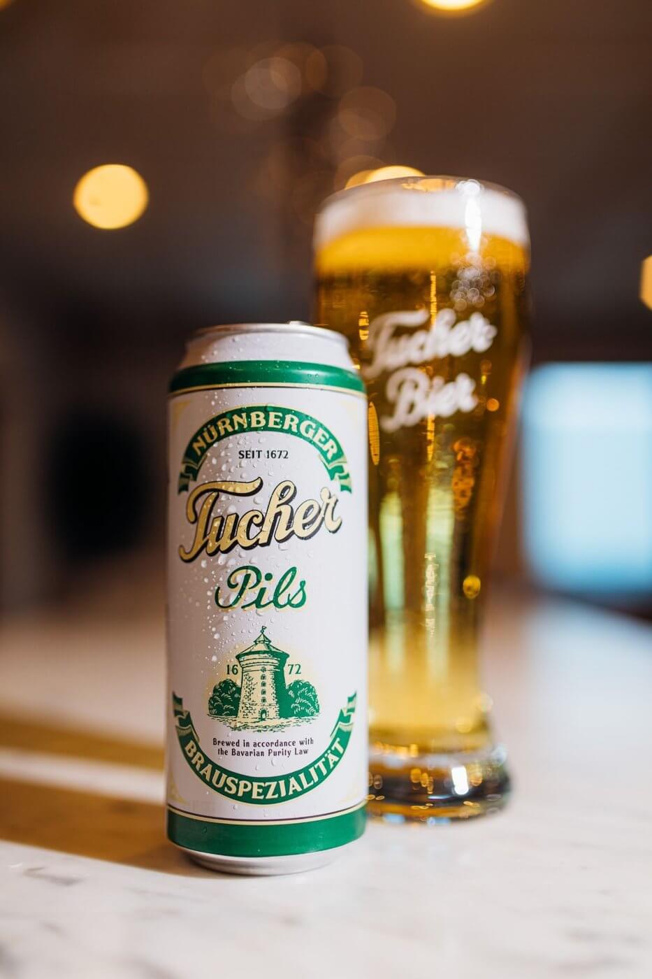 Tucher Pils can with beer glass full of beer